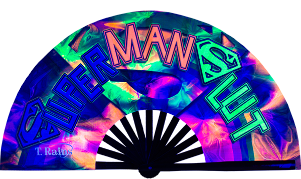 Super Man Slut fan, from Traver Rain's T. Rains Collection, by Wear It! Blacklight / UV responsive!  Find your party accessories for your next rave, music festival, circuit party, or night out at the club at Wear It Apparel! The only place for custom hand fans, plastic fans, bamboo fans, and metal hand fans, neon parasols, and custom parasols and the only place for neon & blacklight fans and parasols. Clack that fan away. #NowWearIt #Clackthatfan